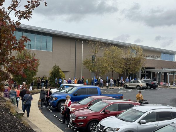 A line of early voters extends to the parking lot at the Grant's View branch of the St. Louis County Library