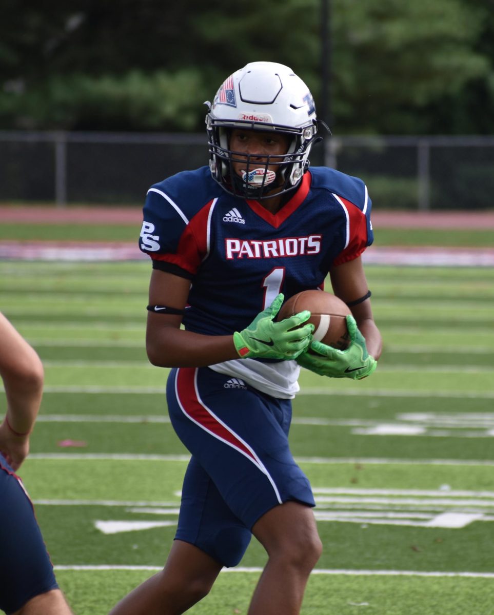 Sophomore running back Jalen Jones looks for a hole in the Longhorn defense. The Patriots won the game, 35-14.