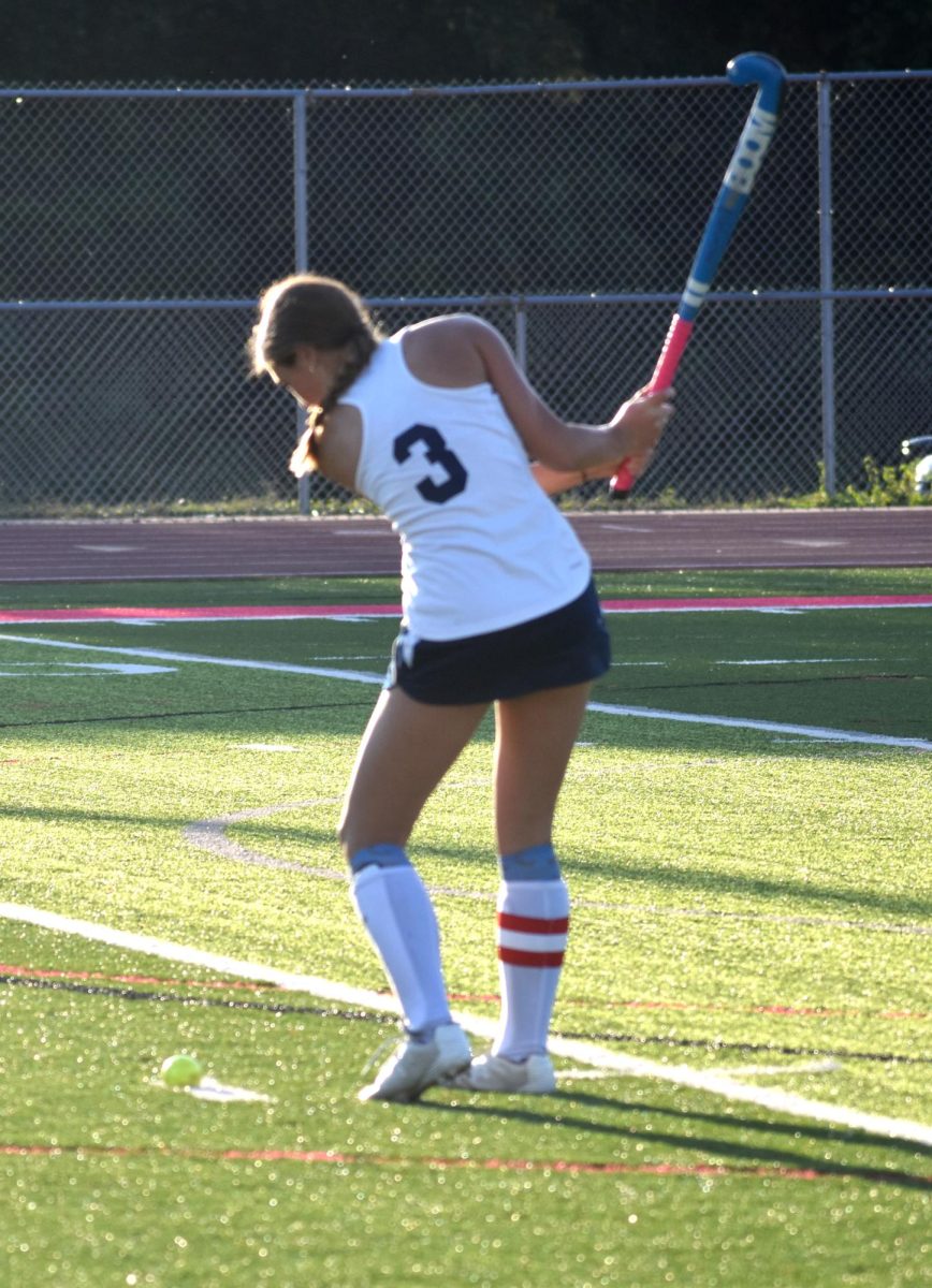 Sophomore midfielder Campbell McCool takes a 16-yard-hit during a game against the Oakville Tigers. 