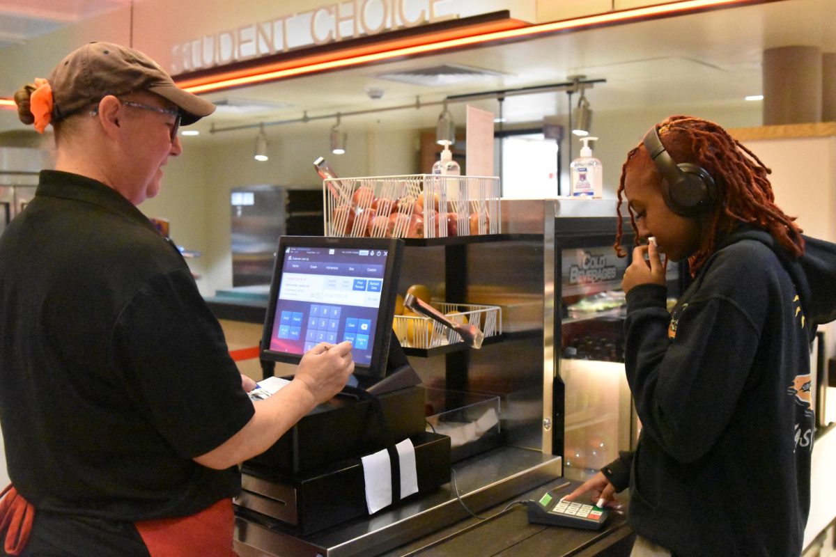 Freshman Lailah Allen pays for her food during third lunch on Wednesday. 