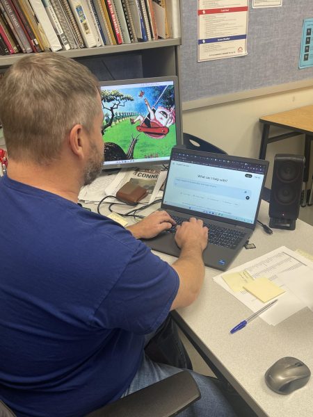 Journalism teacher Mr. Brady uses ChatGPT to help create a headline for this article.