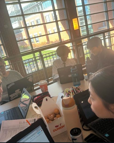 Members of last year's speech and debate club prepare for their events at the tournament at Clayton High School.