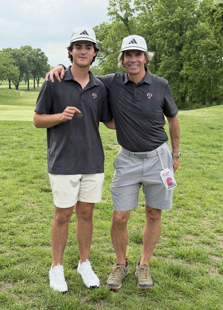 Junior Matthew Delanty takes a picture with his coach, Thomas Williams after he finished third in the district golf tournament. Denanty will represent South High on Monday at the state golf tournament.