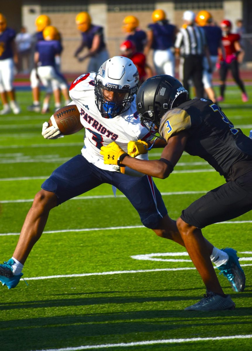 Junior Jalen Jones fights to get past his opponent with the ball.