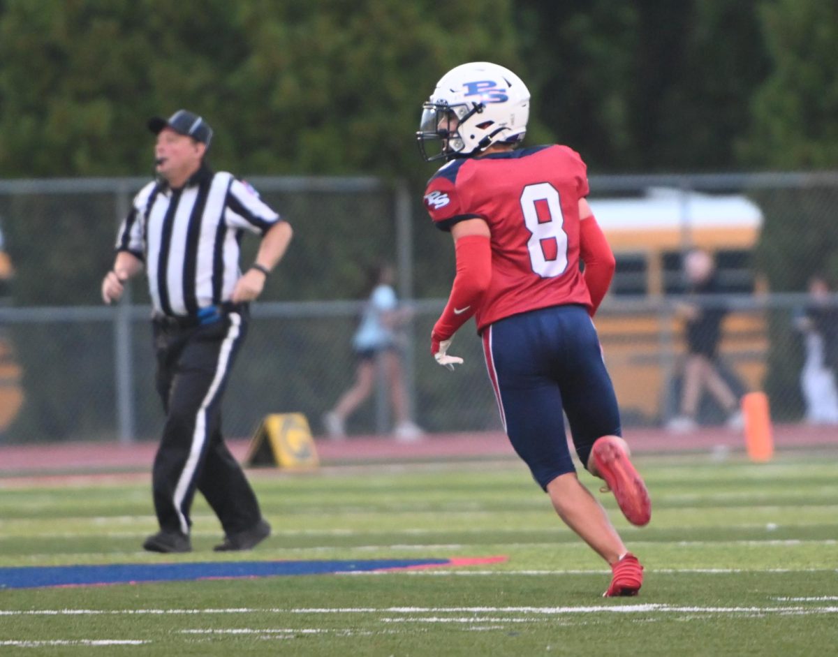 Senior Carson Brandt surveys the field, waiting to make the tackle.