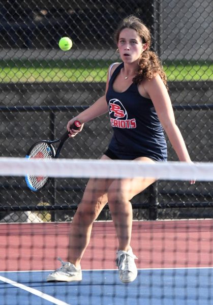 "Hitting the ball over the net with a forehand swing, freshman JV tennis player Aralyn Borts uses skill, and effort to return the ball to the opposing players. In the match up against Parkway West on Oct. 1, Borts shared her feelings about her team,
“I enjoy the people, and environment with the tennis team. My goals for the future (years) is to improve my play and make varsity. My role is (for the team) being a good teammate and playing well."