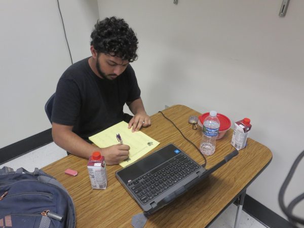 Senior Ayaan Sajid has a protein shake breakfast during 1st block