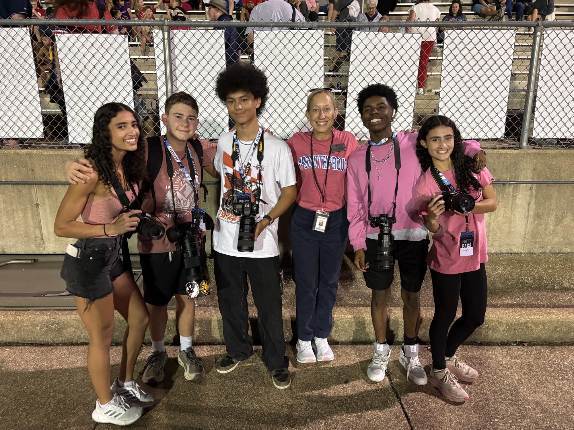 Superintendent Melissa Schneider takes a photo with South High photojournalists Emilly Lima, Ethan Thompson, Ben Besic, Tramon Jackson, and Evelly Lima at the home football game, Oct. 3.