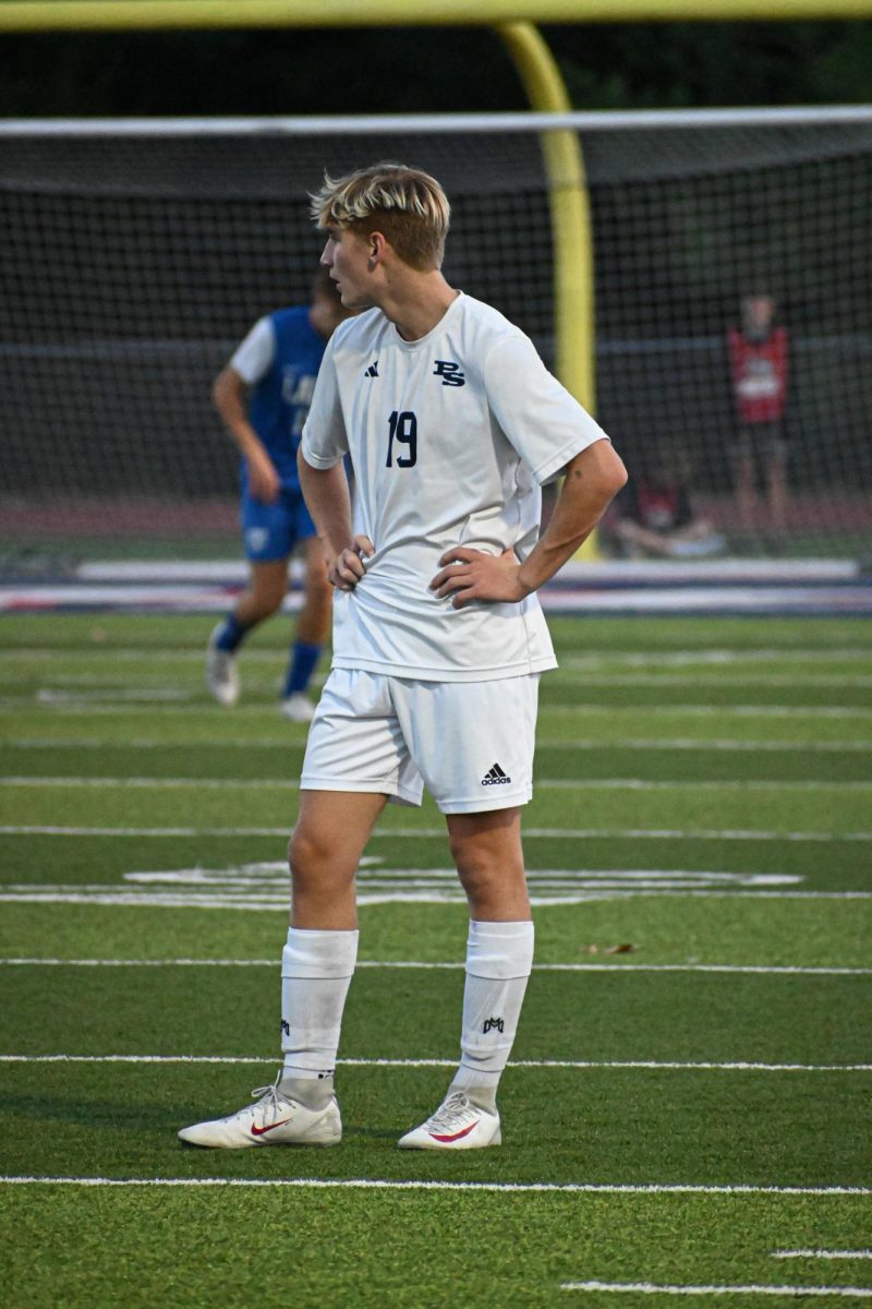 Sophomore forward Tommy Horejes rests during a break in the action in the district soccer game against Ladue. 