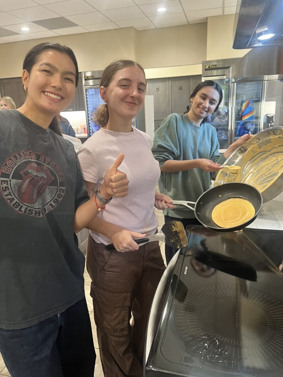 Seniors Leeya Bledsoe, Mariam Rana, and Meghana Hebbar prepare a pancake breakfast at the Ronald McDonald House.