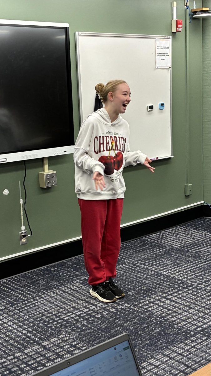 Senior Etta Brazel recites poem at South's Poetry Out Loud competition.