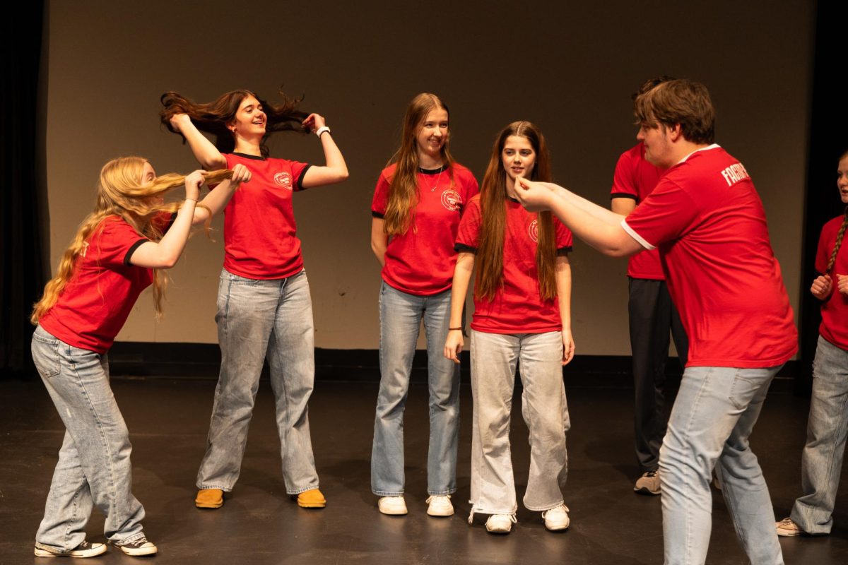 Members of South's improv team Factory Reset work together to improvise a scene.