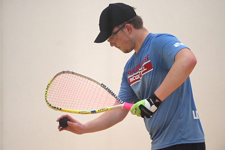 Junior Alec Hayes gets ready to serve the ball during one of his regular season matches. Hayes finished fourth in the nation in doubles this season.