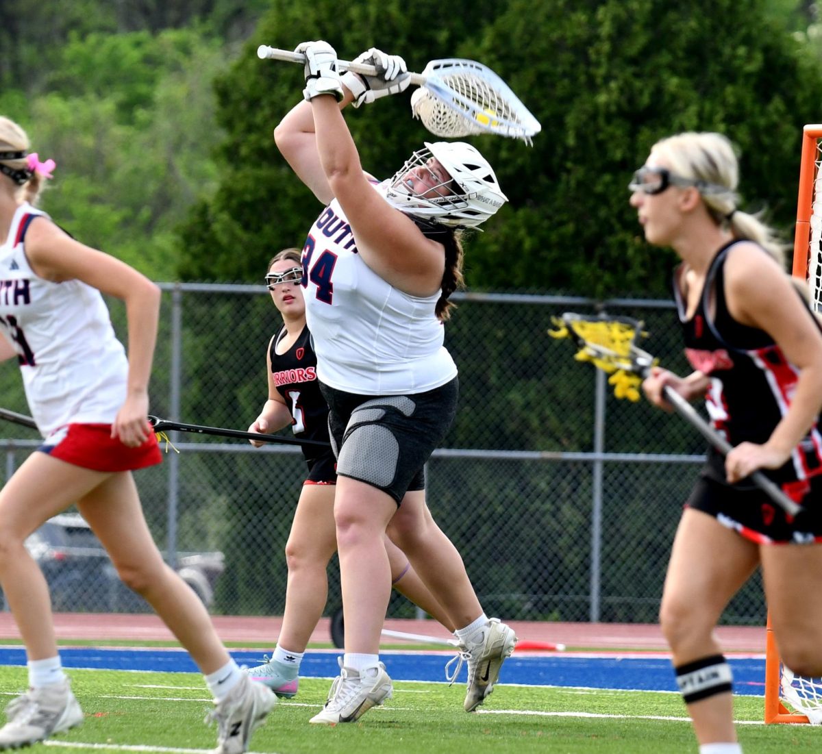 After making another save, senior goalie Natalie Parra launches the ball to the Patriot offense.