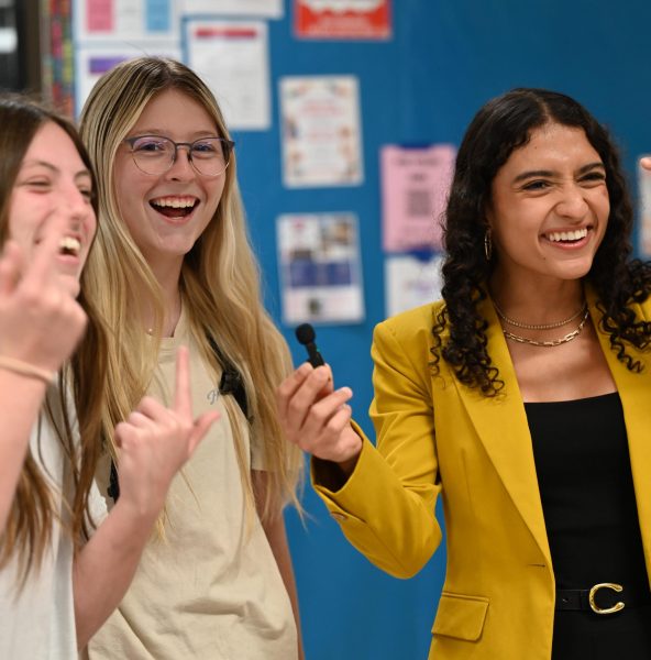 Junior Emilly Lima interviews juniors Lola Sanders and Kaitlin Moore for journalism class.