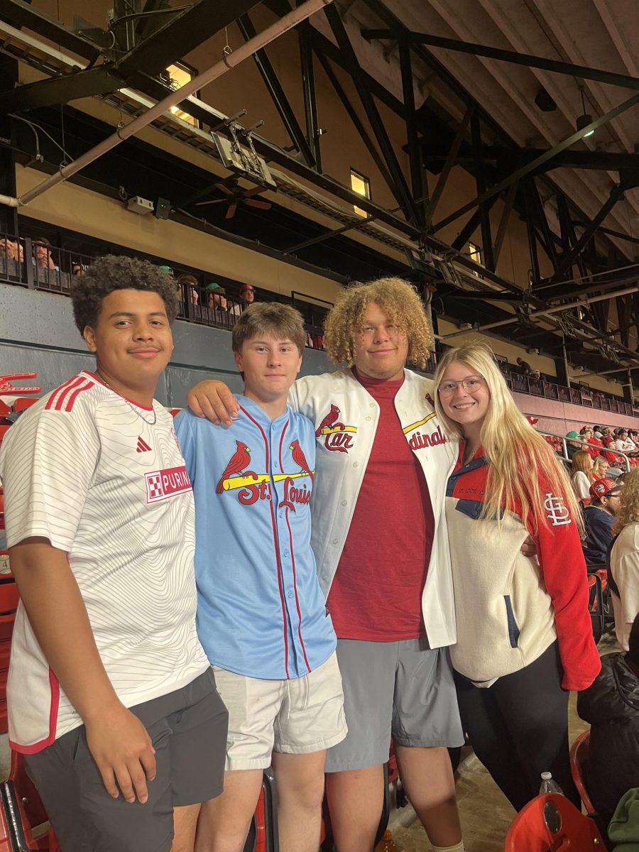 Juniors Brayden Thomas, Carter Holmdahl, Landon Nickerson, and Kaitlin Moore enjoy a Cardinals game.
