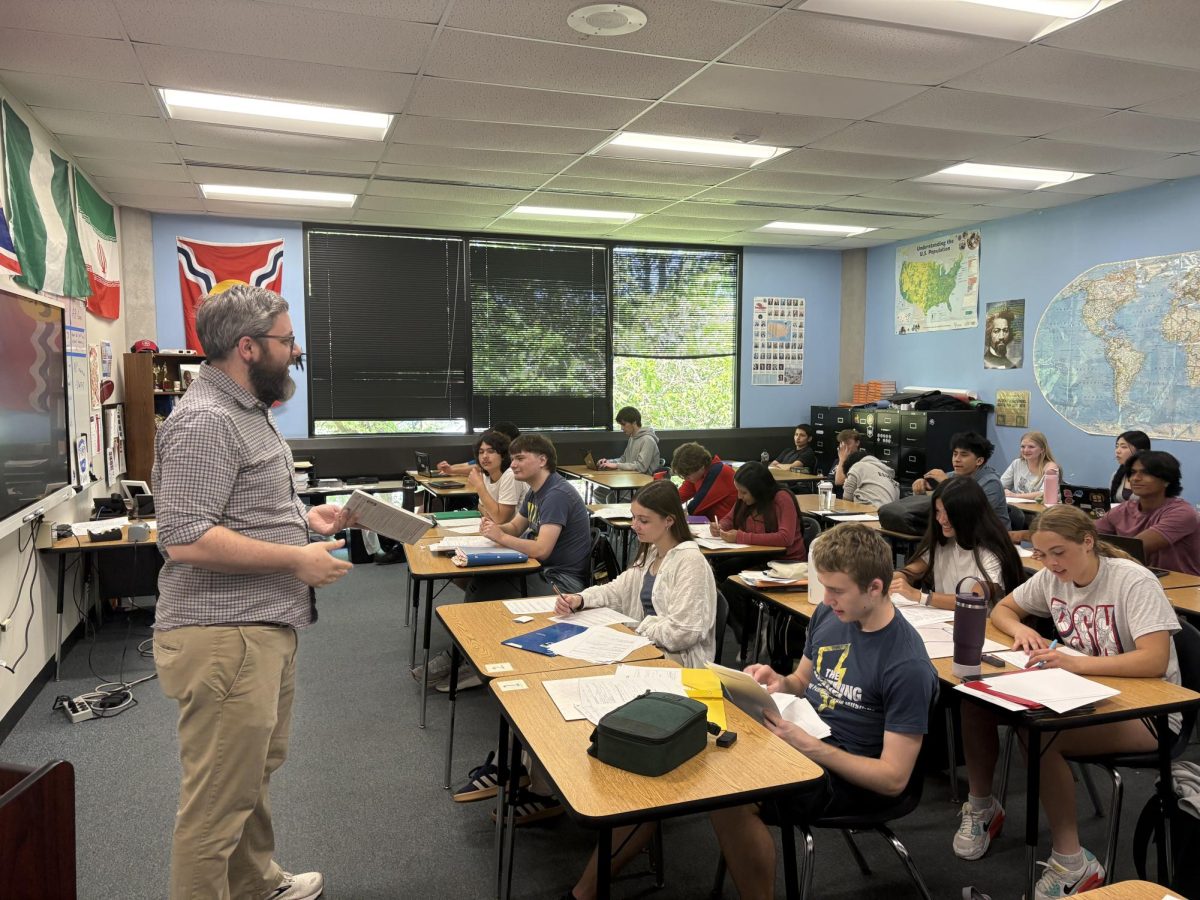 Social studies teacher Pete Wissinger talks to his AP Government class. Wissinger is the sponsor of South's new social studies honor society.