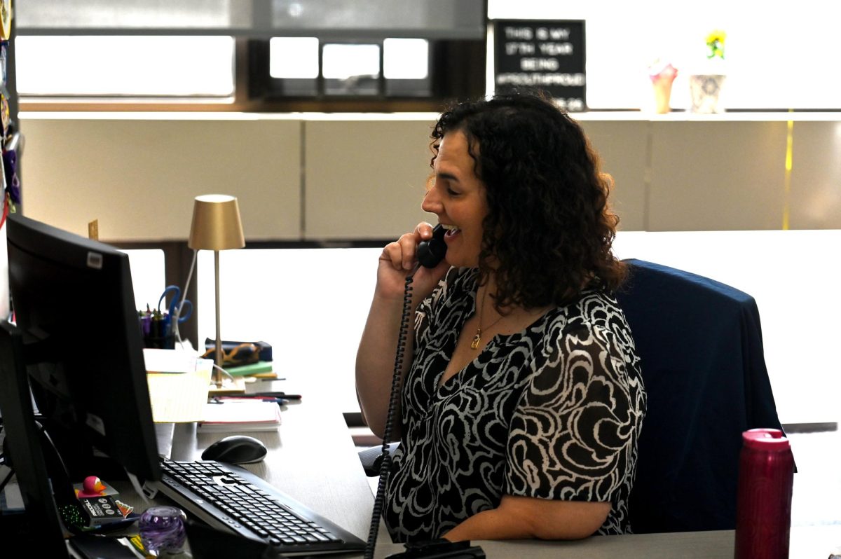 Principal Angie Pappas-Muyco finishes a phone call in her office, April 24. Pappas-Muyco is leaving South for another position in the district after working here for 17 years.